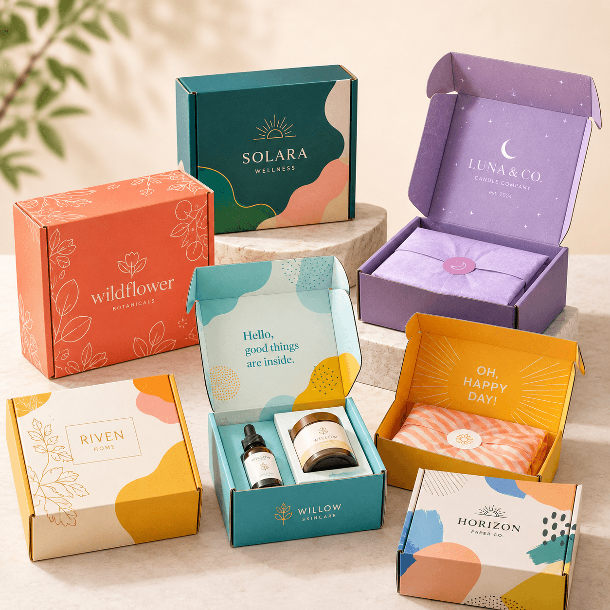 Colourful custom mailer boxes with fictional branding and open packaging display